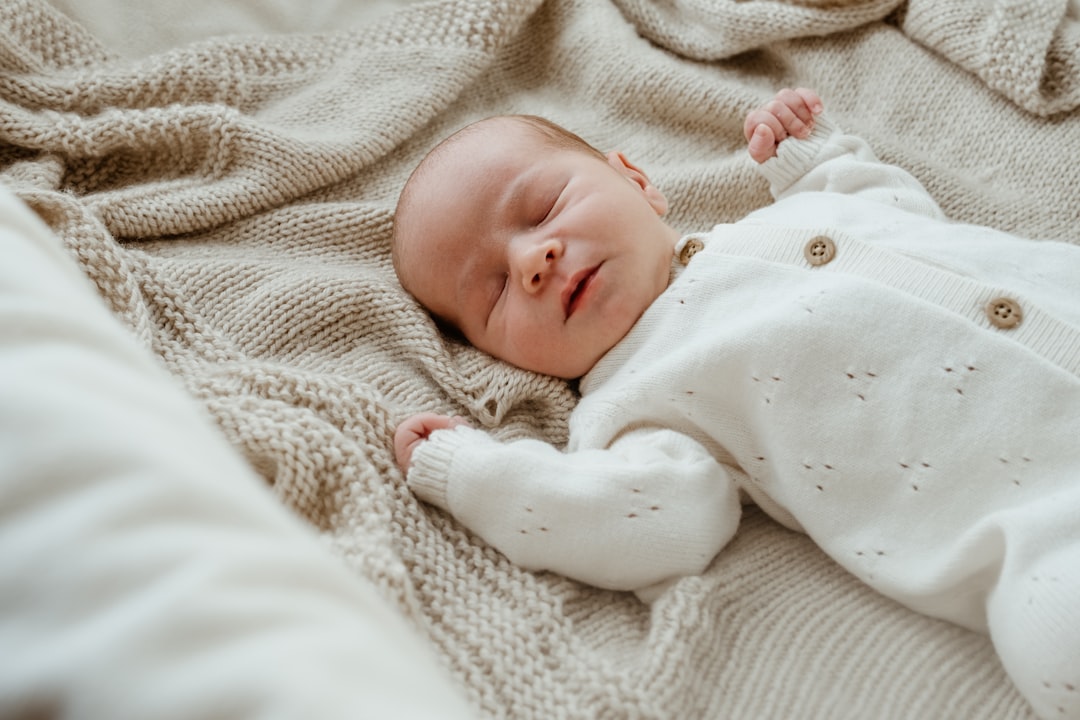 a-newborn-baby-sleeps-peacefully-on-a-soft-blanket-nfe2m4z9rme